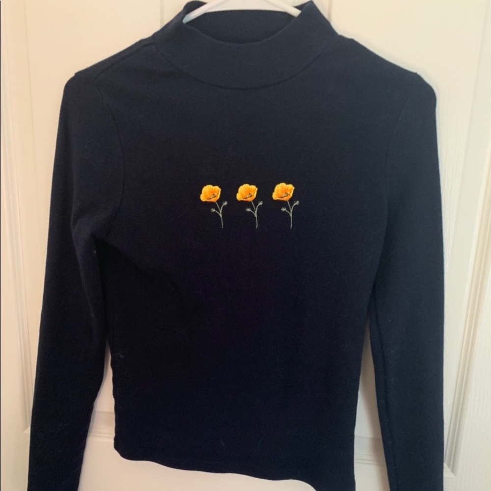 navy blue turtle neck with orange poppies
